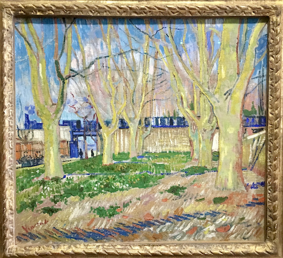 Painting by Vincent van Gogh of a blue train passing behind trees.